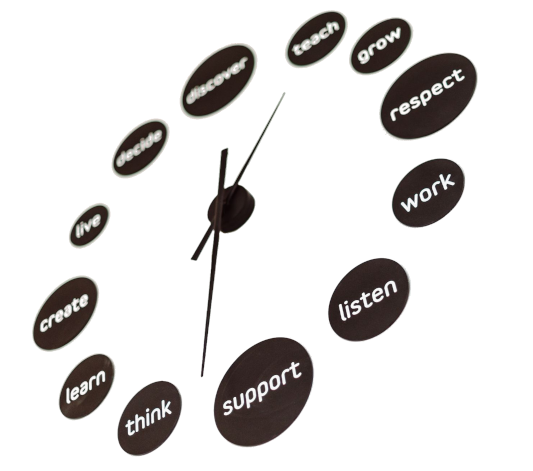 Montessori values displayed on a wall clock